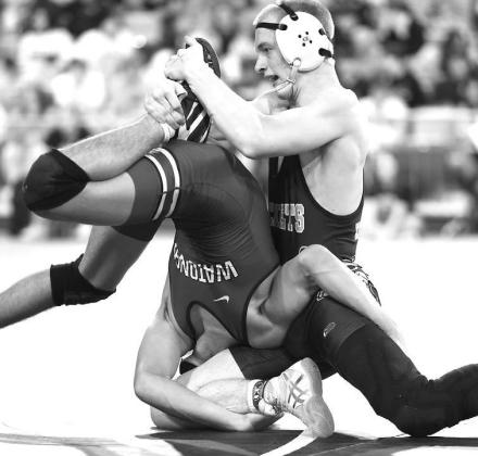 KHS SENIOR WRESTLER Brayden Kochenower, left, and Jaxon Sheppard, right, both won bronze medals at the Class 3A state wrestling tournament. Kochenower is pictured in control of his quarterfinal match before a mistake cost him a loss to Blackwell’s Mason