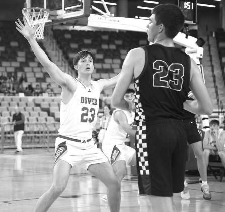 DOVER SENIOR Brennan Fletcher guards Granite’s Eagen Carter during the Longhorns’ quarterfinal win on Tuesday. [KT&amp;FP Staff Photo]
