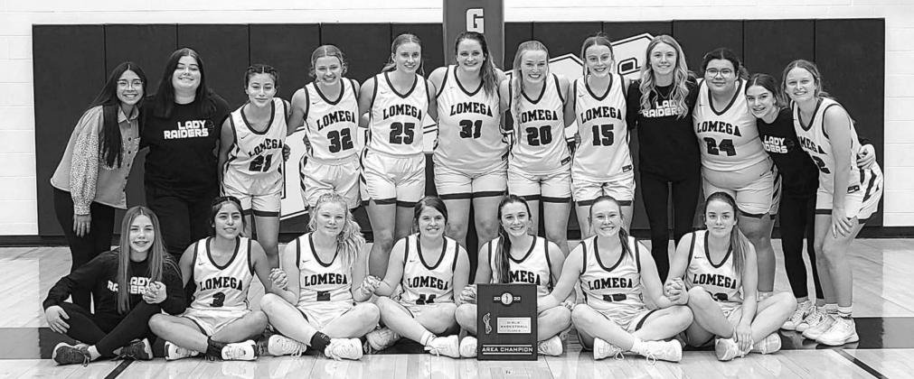 AREA CHAMPS – Lomega’s girls basketball team poses with the area championship plaque it won Monday night with a 58-40 victory over Varnum in the title tilt. The win moves Lomega into the state tournament where it looks for its 16th championship. [Phot Postseason = Raider Season