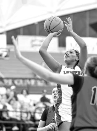 LOMEGA SENIOR Aliana Lawson takes a shot in the paint against Keys in the third-place game. Lawson scored 15 points and had 7 rebounds and 7 steals to go with it while earning a spot on the all-tournament team. [Photo by Russell Stitt/www.stitt.smugmug.co