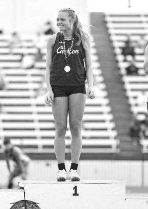 CASHION FRESHMAN Khloe Kastner stands atop the medal stand after winning the long jump at the Class 2A state meet. [Photo by Rylee Broadbent]