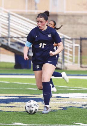 KHS JUNIOR Jennings Broddle pushes the ball down the field during Tuesday’s home loss to OKC Storm. Broddle scored Kingfisher’s lone goal in the game. [Photo by Russell Stitt/www.stitt.smugmug.com]