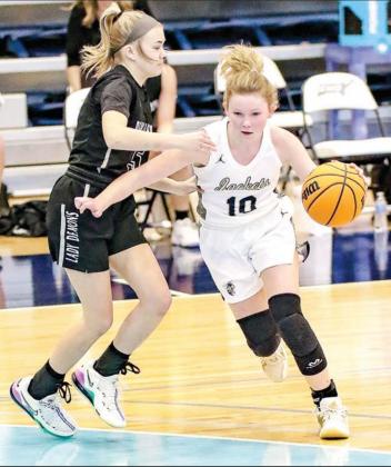 BRITT TAYLOR (20) scored nine points in her final game as a Lady Jacket. KHS lost to Perkins-Tryon in Thursday’s area consolation round and saw its season come to a close. Freshman Peyton Walker (10) led the team with 10 points. [Photos by Chris Simon/w ‘Big’ problems with Perkins