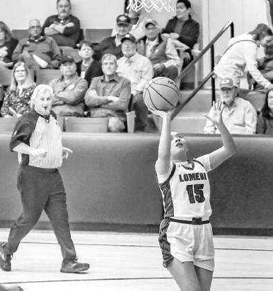 JACKIE PENARAN shoots an uncontested layup during Lomega’s win over Taloga. She scored 17 points in the contest. [Photo by Chris Simon/www.simon-sports-photos.smugmug. com]