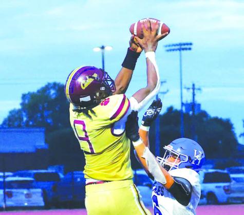 CASHION WIDEOUT King Underwood flies high for a touchdown grab on the final play of the first half in his team’s win against Hennessey. [KT&amp;FP Staff Photo]