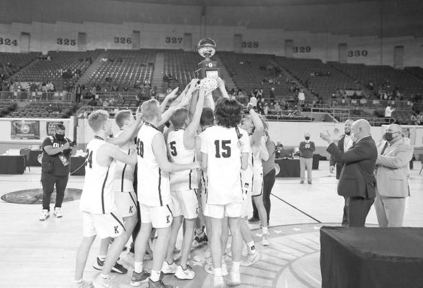 ANOTHER FOR THE COLLECTION —Kingfisher’s boys basketball team raises the gold ball presented to them after winning the Class 4A championship game over Heritage Hall. It was Kingfisher’s third boys basketball championship, all since 2017. The title g Witnessing basketball history