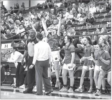 CASHION GIRLS coach Andrea Taylor speaks with an official as team members celebrate a big play during a home win over Seiling on Tuesday. [Photo by Rylee Broadbent]