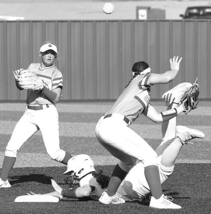 HEELS OVER HEAD – Kendall Farrar slides safely into second base during Thursday’s 4-2 win over Chisholm. [KT&amp;FP Staff Photo]
