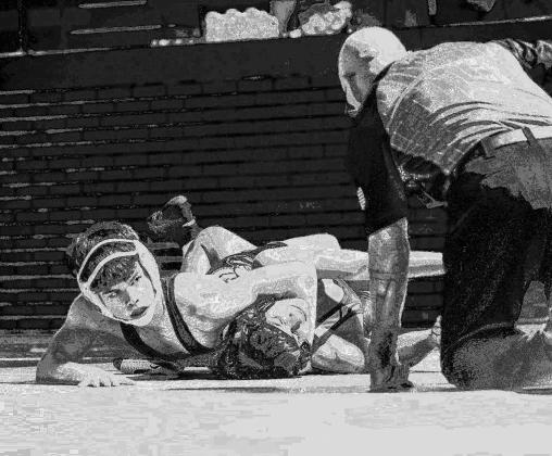 KHS FRESHMAN Kaden Willms pins his opponent’s shoulders to the mat during their 126-pound match Tuesday in Kingfisher. Willms helped the Jackets to a 48-30 win in the dual against Clinton. [Photo by Wyatt Long/KHS Photography]