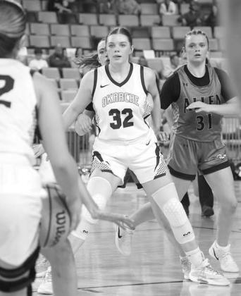 OKARCHE SOPHOMORE Logan White (32) works to gain position in the post to receive a pass from Emory West. [KT&amp;FP Staff Photo]