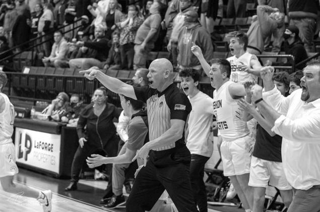 CELEBRATE GOOD TIMES Cashion coach John Hardaway (far right) and players begin to celebrate after the official counts Landon LaGasse’s game-winning bucket in last Friday night’s area title game with Mangum. The win sent Cashion to the Class 2A state t LaGasse does it again for Cashion