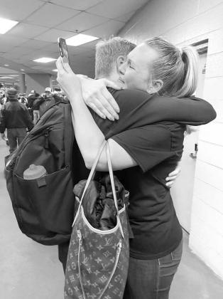 SPECIAL MOMENT – Lindsay Kopp hugs her son, Chase Davis, who had just helped lead Kingfisher to a 51-43 victory in the Class 4A state basketball championship game. Davis was later named the state tournament’s MVP by multiple publications. [Photo provi Chasing Clarity