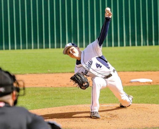 KHS SENIOR Brady Friesen (above) pitched seven strong innings to give KHS a win over McLoud last Tuesday. Pictured right is Cade Stephenson (left) making a catch as he and right fielder Will Taylor converge on a fly ball. [Photos by Chris Simon/www.simon- Jacket pitchers quiet McLoud bats