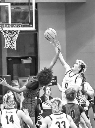 OKARCHE’S Ethan Kirby (0) battles for a rebound during the Warriors’ semifinal win over Watonga on Friday. Kirby scored 30 as the Warriors previaled 116-59. [Photo by Chris Simon/www.simon-sports-photos.smugmug.com]