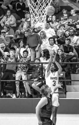 DOVER SOPHOMORE Kyler Willimas (3) shoots over Lomega’s Lance Yost. Williams made eight 3-pointers combined in Dover’s wins on Friday and Saturday. [Photo by Chris Simon/ www.simon-sports-photossmugmug.com]
