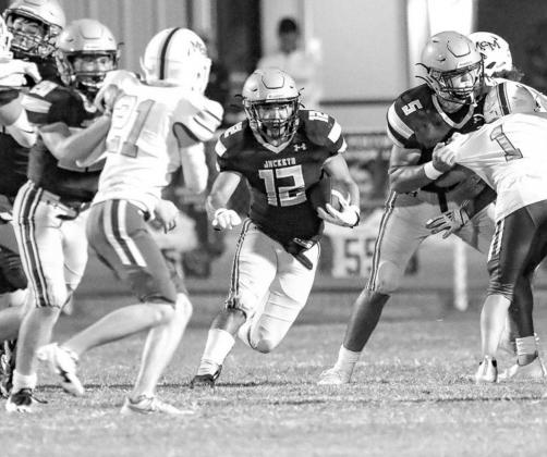KHS SENIOR Alan Muñoz bursts through a running lane during his team’s win over Mount St. Mary. Muñoz ran for more than 90 yards and also kicked the go-ahead field goal late in the fourth quarter. [Photo by Chris Simon/www.simon-sports-photos.smugmug.c Alan wrenches Mount’s upset bid
