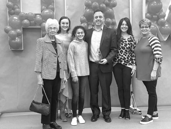 FAMILY MEMBERS who all apparently knew about the Citizen of the Year Award included, from left: my grandmother Kaye Mitchell, sister Kayela Mosley, daughter Maya Haney, wife Julie Swisher and mother Teri Swisher. Everyone was in on the deception...except me