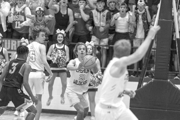 THE PASS - Cashion’s Jonah Jenkins sends a pass downcourt to Landon LaGasse (foreground) in the waning seconds of the team’s area title game. LaGasse caught the pass and made a layup as the buzzer sounded to give the Wildcats a dramatic 48-46 win agai LaGasse does it again for Cashion