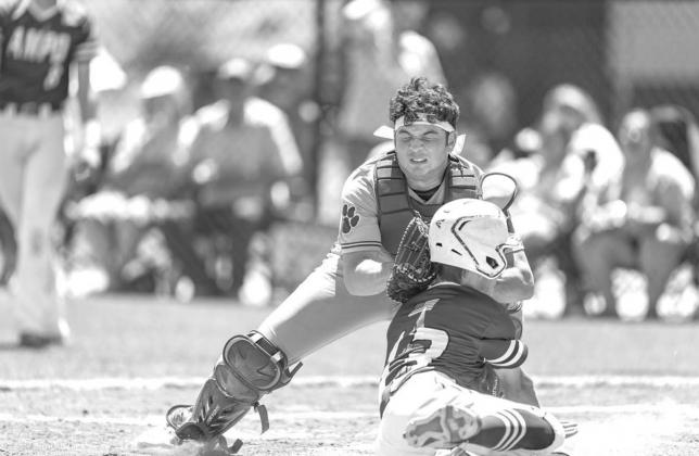 CASHION CATCHER Nick Nabavi tags out Amber-Pocasset’s Ethan Herrera in a play at the plate during the third inning of the Wildcats’ 15-6 win in the Class 2A quarterfinals. The out came on a throw from Gavin Phippen in left field. [Photo by Brad Stone/ ‘Cats bats too much for Am-Po