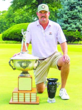 KINGFISHER’S Heath Myers poses with the trophy that will have his name etched on it a third time after winning the OGA Mid-Amateur Championship last week. [Photo by Connor Koenig/Golf Oklahoma]
