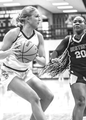 ABBIE MYERS works to put up a shot during Friday’s game against Destiny Christian. The senior scored 26 and hit the game winner for KHS. [Photo by Chris Simon/www.simon- sports-photos.smugmug.com]