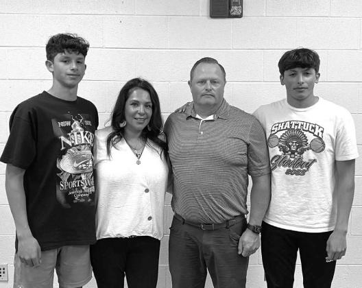 HENNESSEY’S BOARD of education on Monday approved the hiring of Brian Richardson as its next girls basketball coach. Richardson was at the meeting along with his wife, Jenny, who was also hired to teach in the district, and their twin sons Camdyn (far l Hennessey tabs Richardson next girls coach