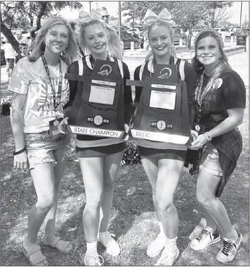 IT’S A FAMILY THING - Making winning the school’s first state cheer championship all the more special for coaches Amber Hobgood (far left) and Casi Williams (far right) was having their daughters on the team. Abby Hobgood is a junior while Reese Willi Cashion overcomes obstacles to win state