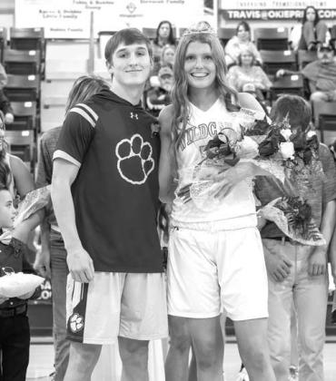 CASHION SENIOR Max Brown, left, was crowned the basketball homecoming king last Friday night while junior Laynee Woody was announced as the queen during a coronation ceremony before the teams hosted Wellston. [Photo by Brad Stone/www.bestone.shootproof.co Homecoming Night Heroics