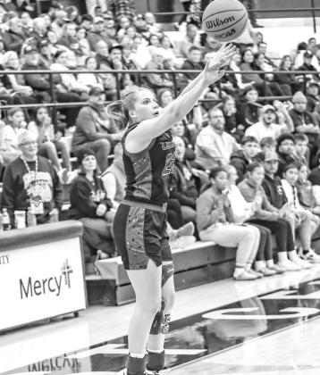 SHARP-SHOOTING Hadley Ott, pictured attempting a 3-pointer at the Bertha Teague Mid-America Classic, was one of the reasons Lomega won its 11th straight Cherokee Strip Conference Tournament championship last week. [Photo by Chris Simon/www.simon- sports-p SHARP-SHOOTING Hadley Ott, pictured attempting a 3-pointer at the Bertha Teague Mid-America Classic, was one of the reasons Lomega won its 11th straight Cherokee Strip Conference Tournament championship last week. [Photo by Chris Simon/www.simon- sports-p
