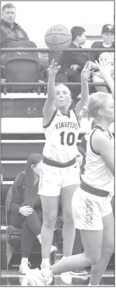 KHS SENIORS Abbie Myers (3) and Reese Roof (10) came up big in their team’s win against Howe on Monday. Myers, pictured driving the baseline during the game, scored 10 of her 14 points in the fourth quarter. Roof is shown shooting one of her six made 3-