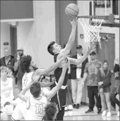 KHS JUNIOR Matthew Stone lays in a bucket during his team’s season-opening win at Newcastle last week. Stone had 17 points and 15 rebounds for second-ranked KHS. [Photo by Chris Simon/www.simon-sports-photos.s KHS JUNIOR Matthew Stone lays in a bucket during his team’s season-opening win at Newcastle last week. Stone had 17 points and 15 rebounds for second-ranked KHS. [Photo by Chris Simon/www.simon-sports-photos.s