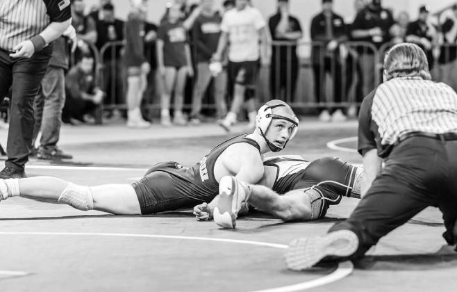 KHS SOPHOMORE Jaxon Sheppard looks at the official as he tries to pin Kolbe Bargas of Vinita during their 132-pound wrestle-in match at the Class 3A state tournament on Thursday. Sheppard didn’t get the pin, but he did get a 20-15 victory to move into t