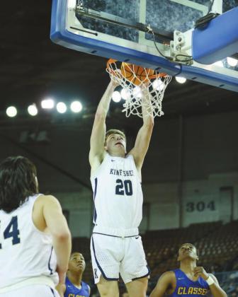 JARRET BIRDWELL (20) throws down a dunk during the third quarter of Kingfisher's 58-33 win over Classen SAS in the Class 4A semifinals on Friday at State Fair Arena. Birdwell led the Jackets with 14 points and eight rebounds as they qualified for the stat SEMIFINAL SLAM