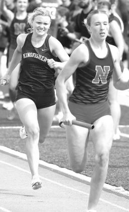 ABOVE: Reese Hobgood (background) urges on Khloe Kastner after handing off the baton in one of two relays in which the duo helped Cashion win at last week’s Cashion Wildcat relays. BELOW: Kingfisher’s Scout Snodgrass tries to run down North Rock Creek