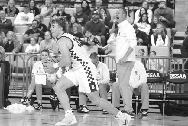 OKARCHE COACH Aaron West (background) barks instruction to his team and Easton Roby prepares to pass it up the floor during Wednesday’s quarterfinal win at OG&amp;E Coliseum. [KT&amp;FP Staff Photo]