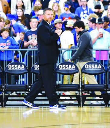 TIMELINE OF AN AMBUSH – Prior to last Saturday’s championship game, Lomega coach Kevin Lewallen stood alone by his bench as he awaited tipoff. After the Lady Raiders won a state championship, giving Lewallen the most as a girls head coach in Oklahoma,