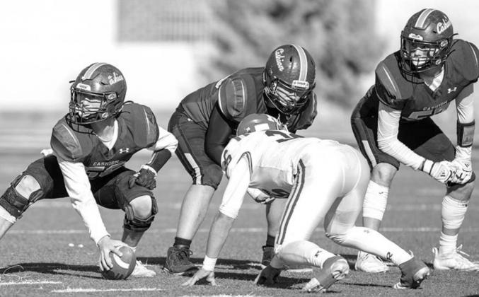 CASHION SENIOR center Joey Wilson, far left, makes a final read of the Ringling defense before snapping the ball in the Class A state championship game at Chad Richison Stadium in Edmond. Preparing for the snap are guard Tommy Branson and tackle Preston C MANNING AMONG BOYS