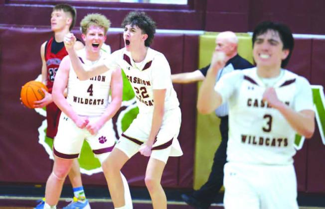 CASHION PLAYERS Brayden Stuemky (4), Grayson Little (22) and Parker Mitchell (3) react after Little made a bucket while being fouled to help seal their team’s win over Watonga on Thursday night. [KT&amp;FP Staff Photo]