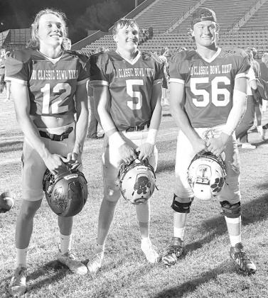 Classic Bowl teammates Cashion’s Ben Harman, left, and Joey Wilson, right, suited up together one final time last Saturday for the East squad during the Classic Bowl XXXIV football game in Woodward. They were joined by Kingfisher’s Slade Snodgrass, ce Snodgrass has strong showing at Classic Bowl football game