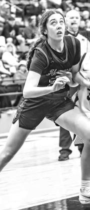 HENNESSEY’S Clare Munroe battles for position during a Three Rivers Conference Tournament semifinal game against Okarche. Munroe scored 24 points last Tuesday in her team’s victory against Watonga. [Photo by Chris Simon/ www.simon-sports-photos.smugmu HENNESSEY’S Clare Munroe battles for position during a Three Rivers Conference Tournament semifinal game against Okarche. Munroe scored 24 points last Tuesday in her team’s victory against Watonga. [Photo by Chris Simon/ www.simon-sports-photos.smugmu