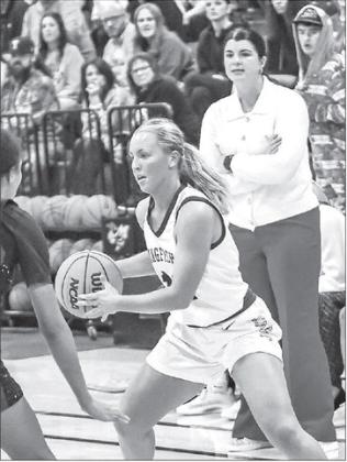 REESE ROOF - with head coach Taylor Young overseeing in the background - scored a game-high 18 points last Tuesday in Kingfisher’s 45-34 victory against Tuttle at the APB. [Photo by Chris Simon/www.simon-sports-photos.smugmug.com]