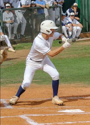 KHS SENIOR Tate Taylor prepares to lay down a bunt during a game early last week. Taylor was instrumental Thursday in his team’s bi-district sweep of Bridge Creek which advanced the Jackets to the regional tournament. [Photo by Chris Simons/www.simon-sp Daugherty hunts Bobcats with bat
