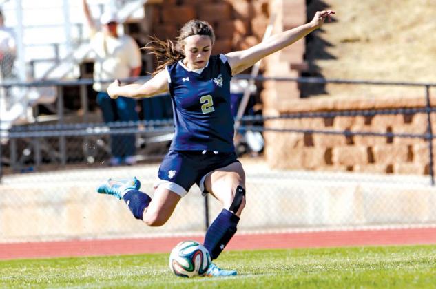 KHS SOPHOMORE Kylee Rojas delivers a kick during a game earlier this season. Rojas had two penalty kick goals on Tuesday, the second of which gave the Lady Jackets a 2-1 sudden victory overtime win at Cushing in their district opener. [Photo by Chris Simo Into the wind...