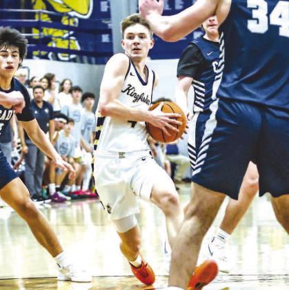 CASH LAIRD drives down the lane during the first half of last week’s game against Casady. Laird scored 18 points to help lead the Jackets to a 55-48 win. [Photo by Chris Simon/www. simon-sports-photos.smugmug.com]