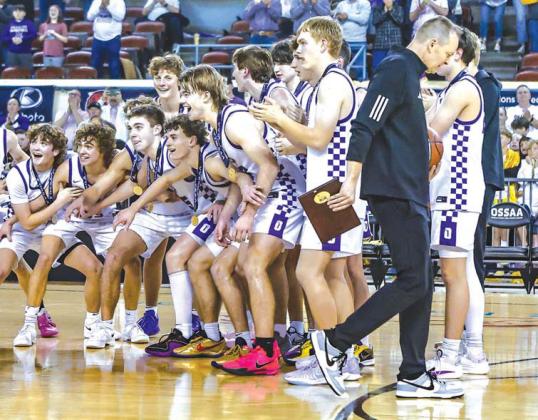 OKARCHE’S BOYS basketball team prepares to collect the gold ball after winning the 2025 Class A state championship, its second straight, last March. Many from that team will take the court in Tulsa this week at the 60th Tournament of Champions. [Photo b