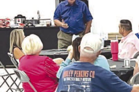 HENNESSEY TOWN Trustee David Jones tells citizens Wednesday night about how he has dealt with resistance, arguments and confrontation while on the Hennessey Board of Trustees and Utilities Authority. [Photo by Barb Walter]