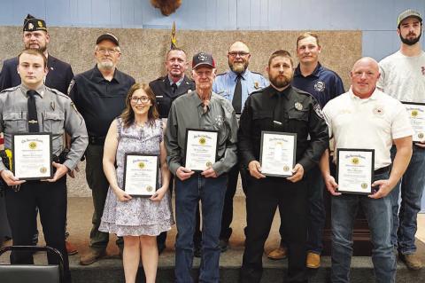 FIRST RESPONDERS honored during a meeting of the Post 5 of the American Legion on Sunday were, from left: front row, Steven Renbarger of the Kingfi sher Police Department; Bryann Walls of Kingfisher County 911; Richard Meyer of the Loyal Fire Department, 