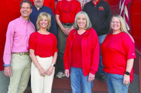 WALTER BUILDING CENTER staff today includes, from left: front row, Brian Walter, Liz Walter, Phyllis Click and Dionne Harrison; second row, Gary Austin, Doug Smiley and Mark Westman; and back row, Chris Blair, Larry Bilger and Keil Larsen.