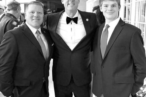 Kingfisher’s Mike and Davis Sanders attended the Christmas party of Governor Kevin Stitt (pictured center) and First Lady Sarah Stitt last Saturday at the Governor’s Mansion and Pavilion. Mike Sanders, left, is the executive director of the Oklahoma B