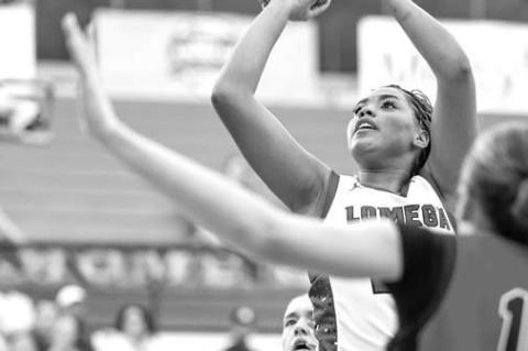 LOMEGA SENIOR Aliana Lawson takes a shot in the paint against Keys in the third-place game. Lawson scored 15 points and had 7 rebounds and 7 steals to go with it while earning a spot on the all-tournament team. [Photo by Russell Stitt/www.stitt.smugmug.co